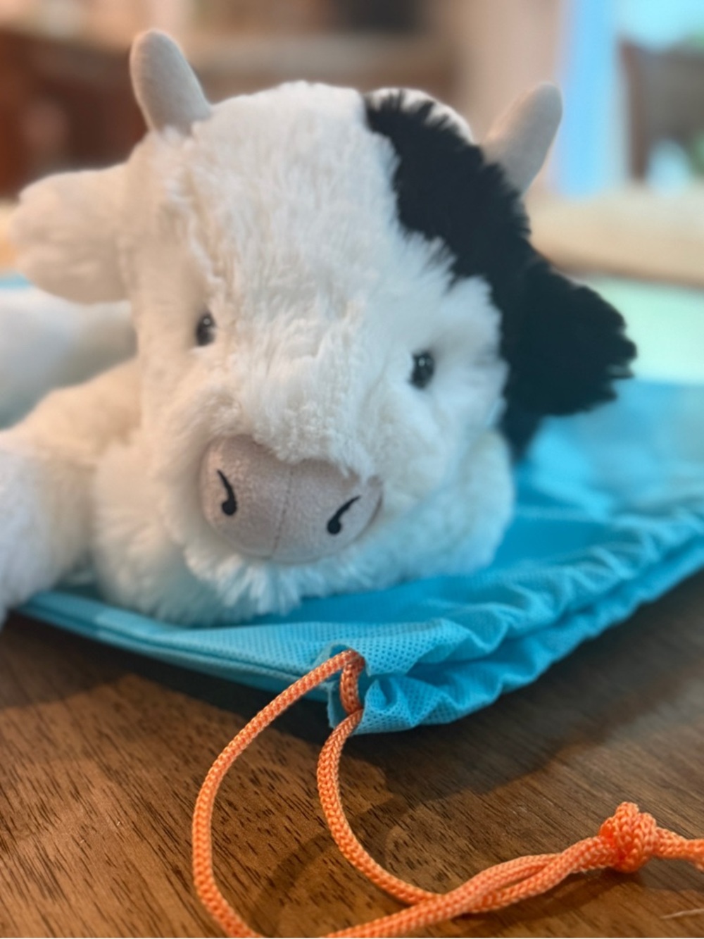 Jellycat Smudge Cow Plush in White and Black with Teal Accent